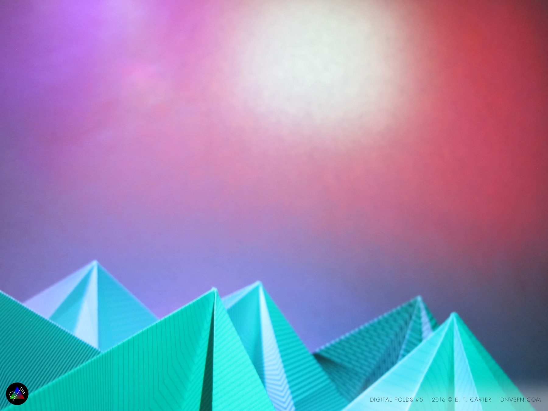 Teal pyramids, pink sky.