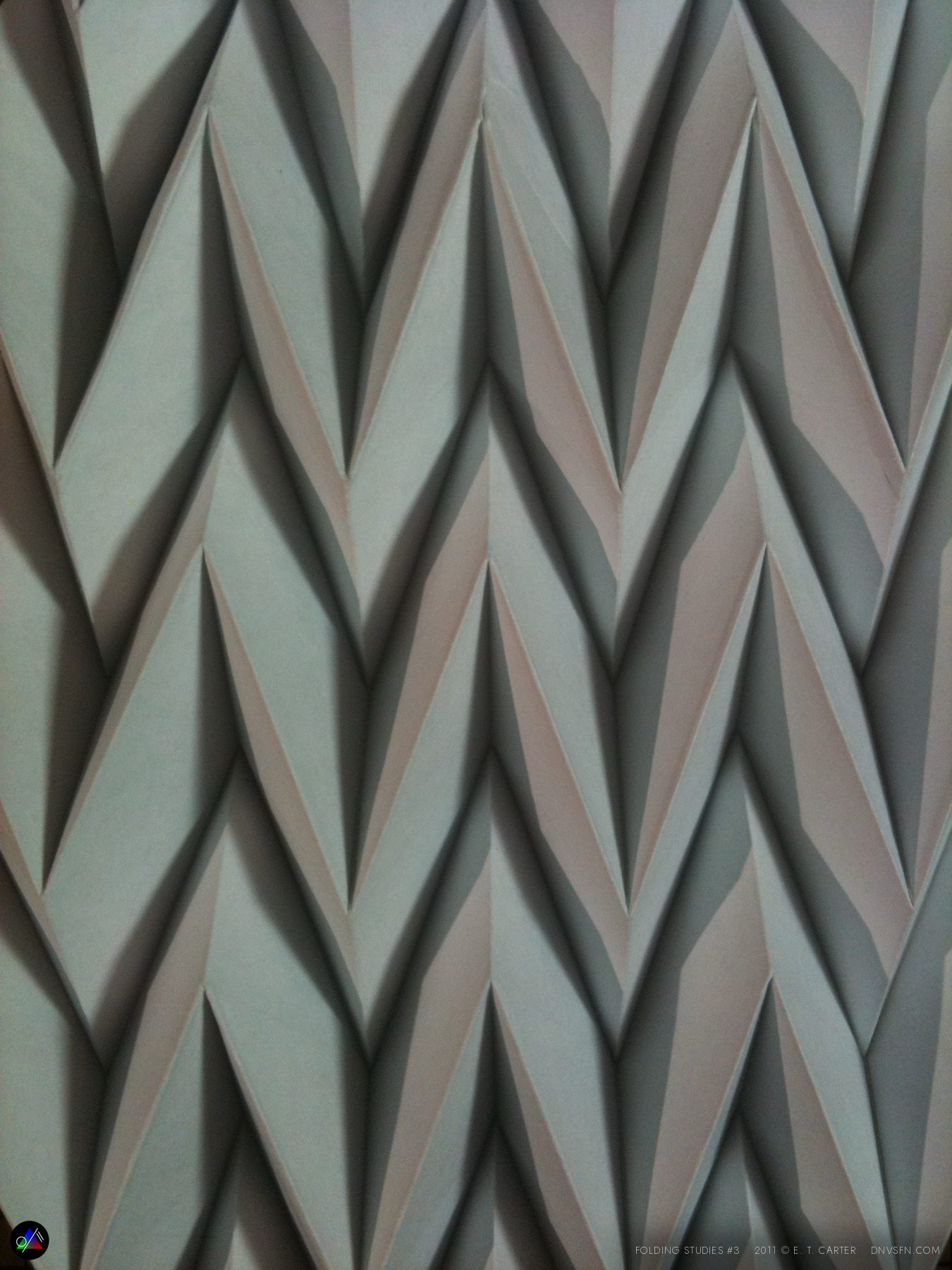 Pleats catching colored light.