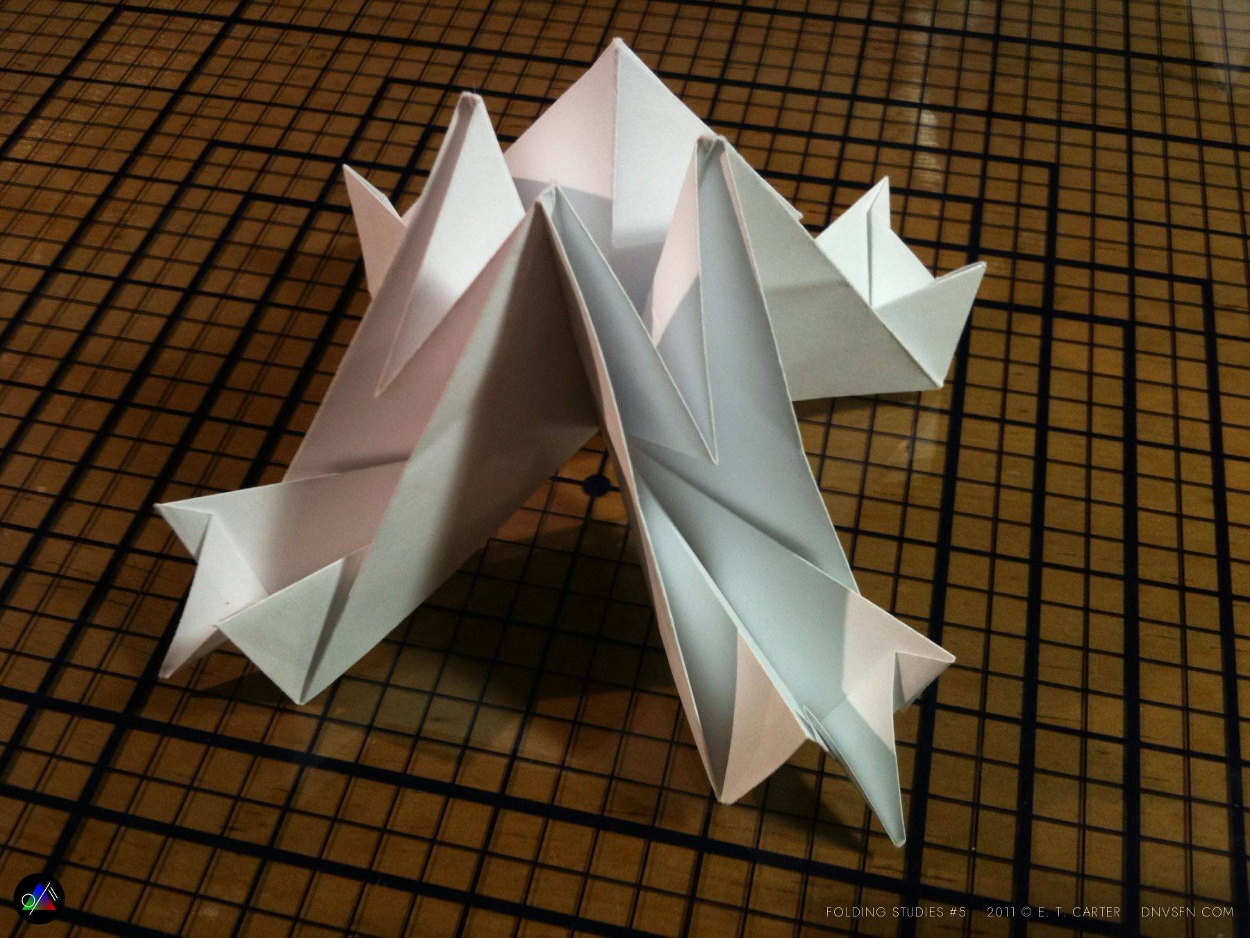 Folded up into a standing X.