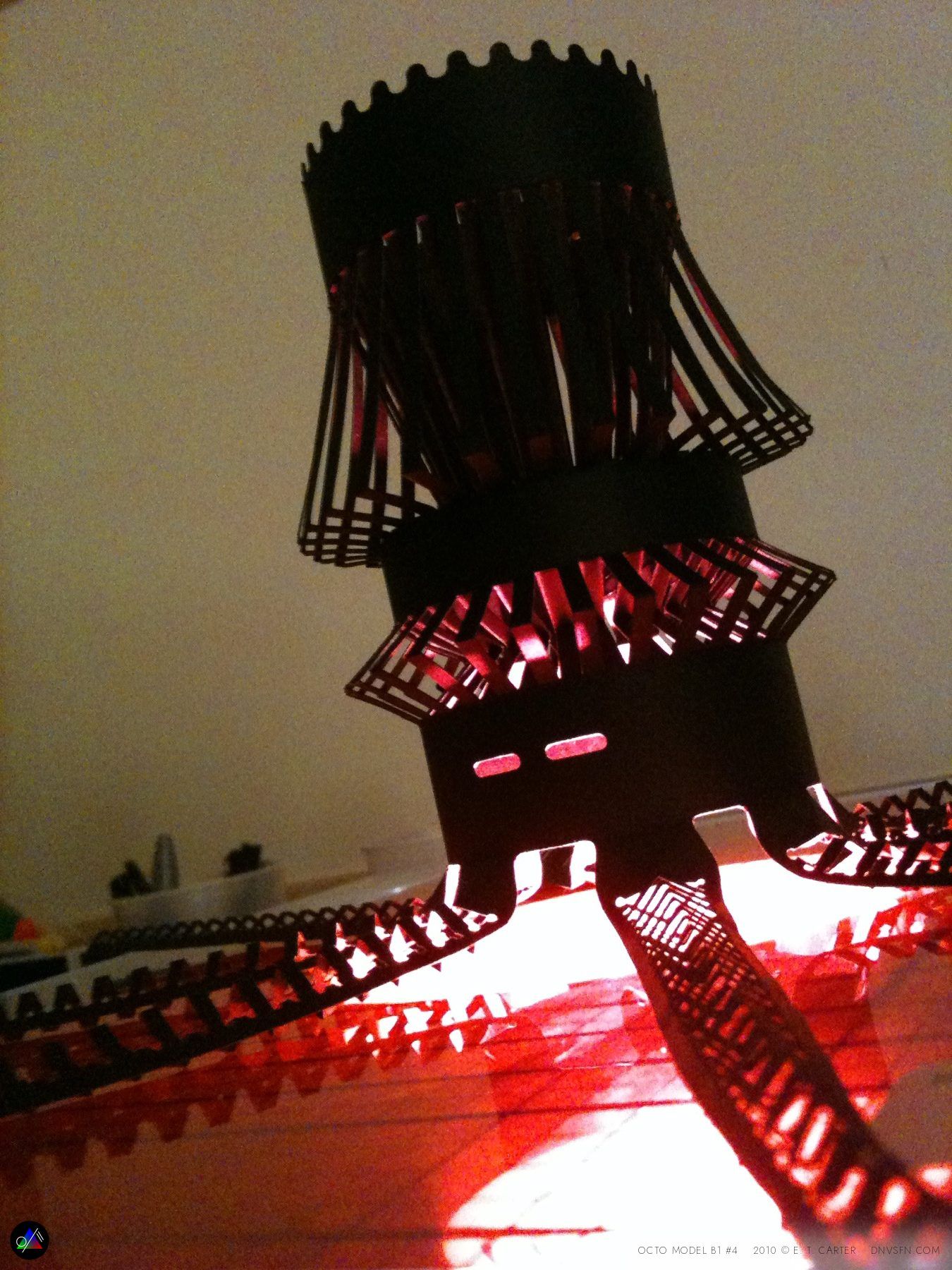 Standing, backlit red.