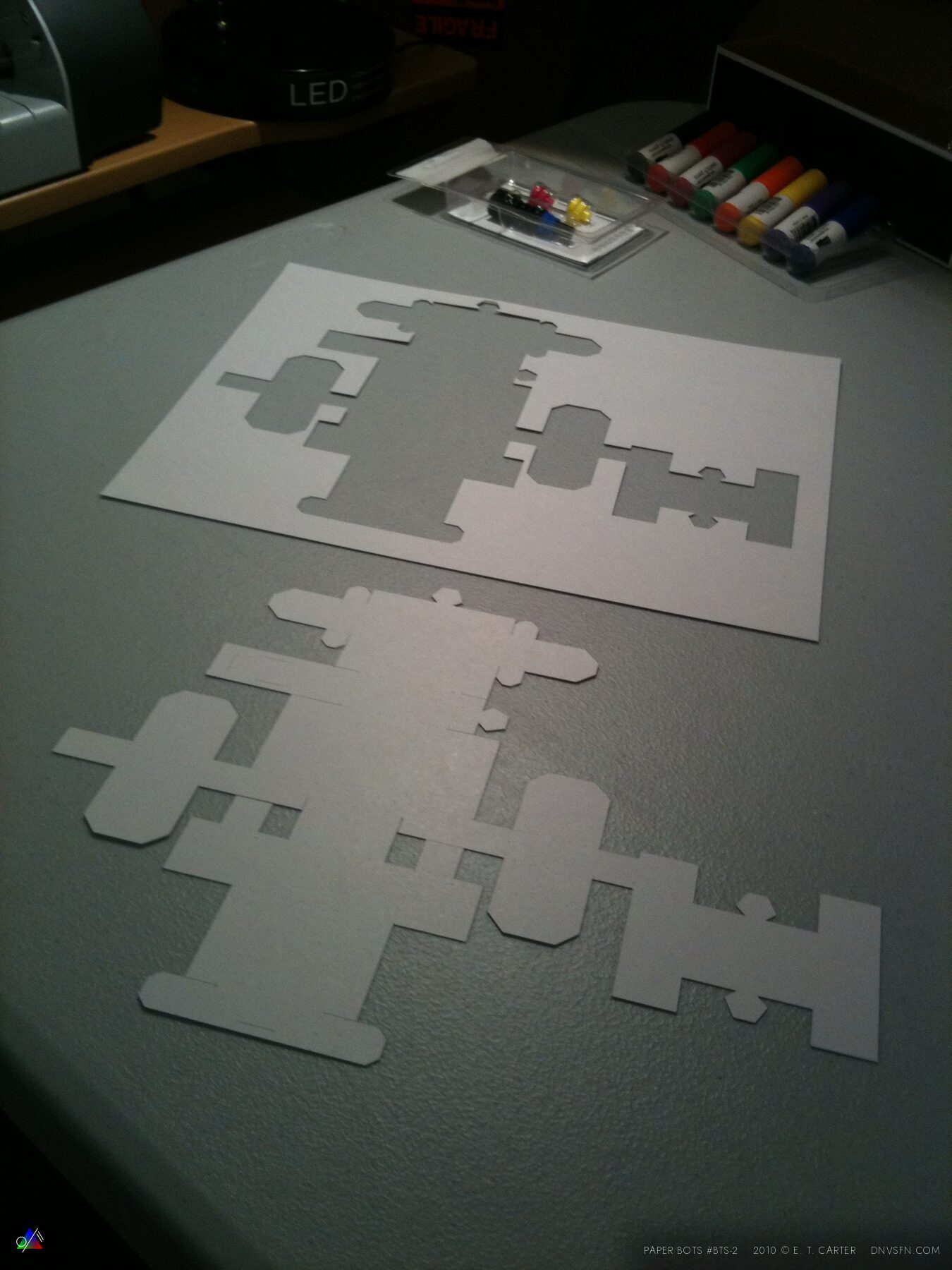 Plotter-cut blanks on the workbench.