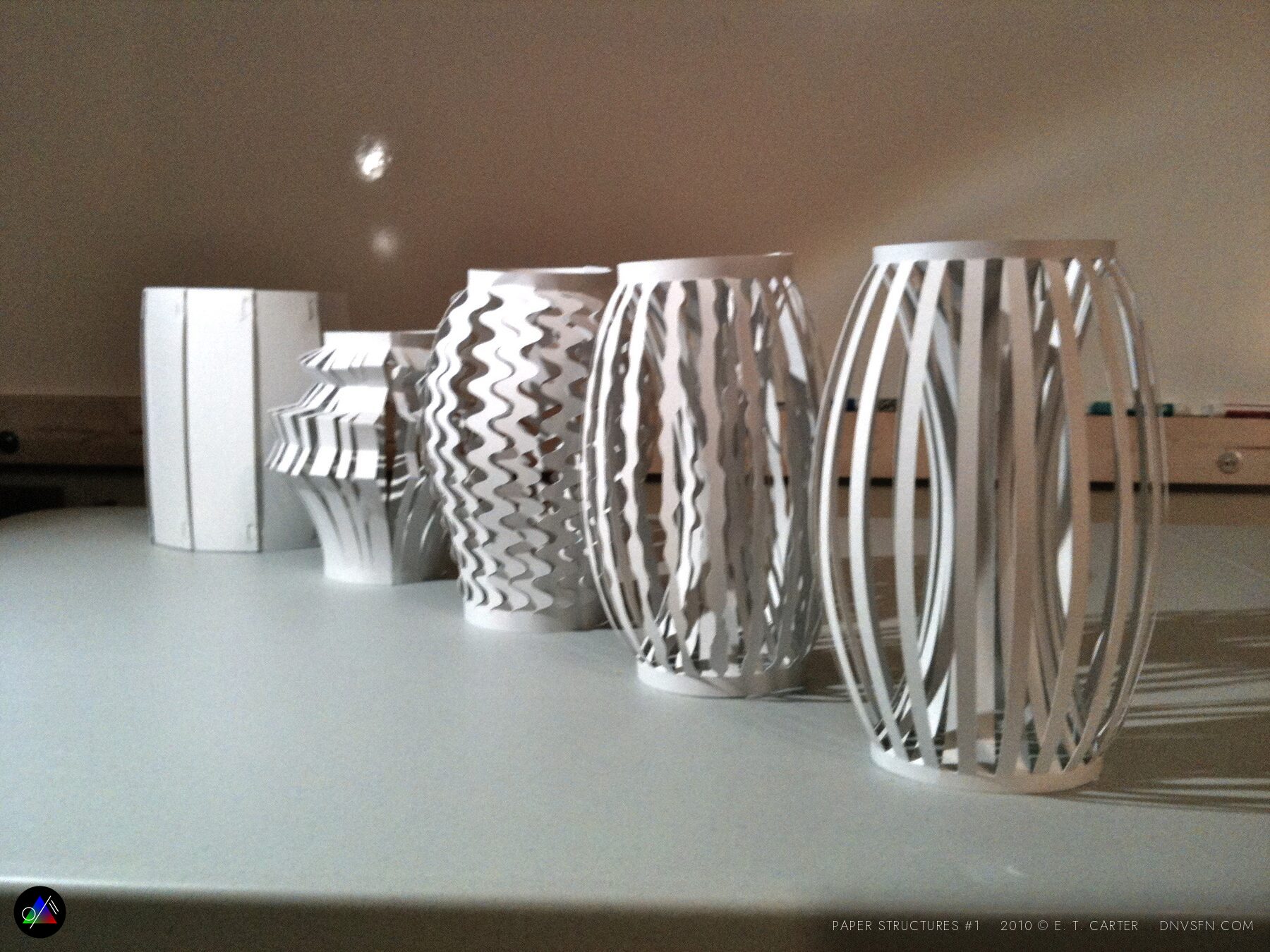 A row of pleated cylinders.