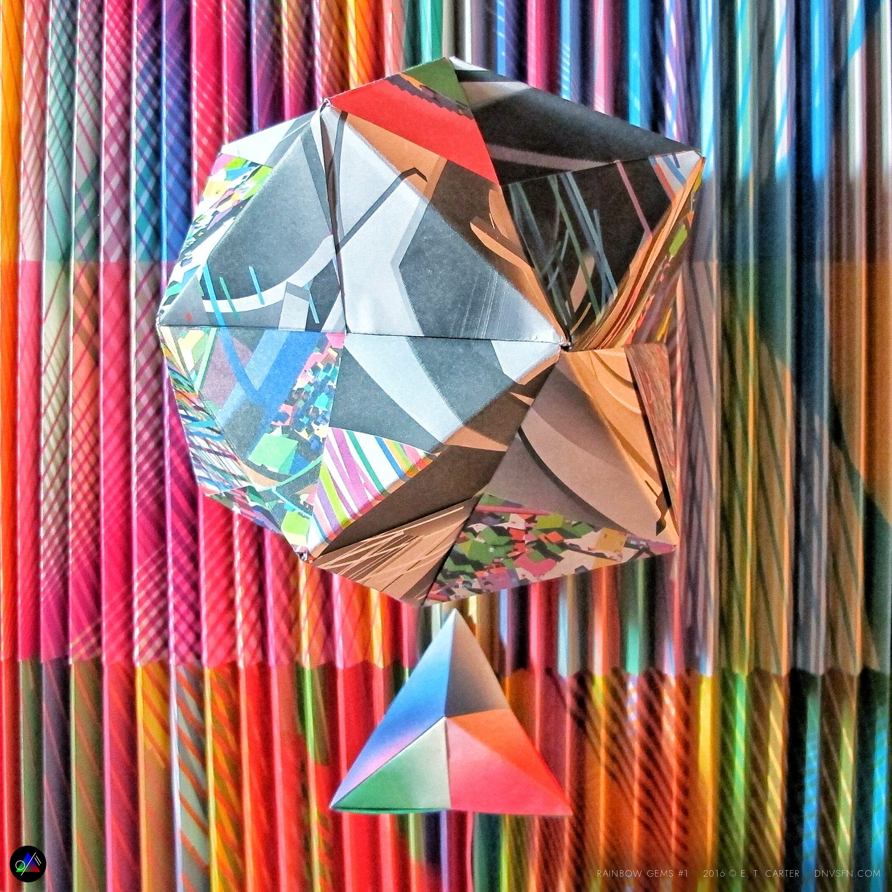 Mirror gem on a rainbow wall.