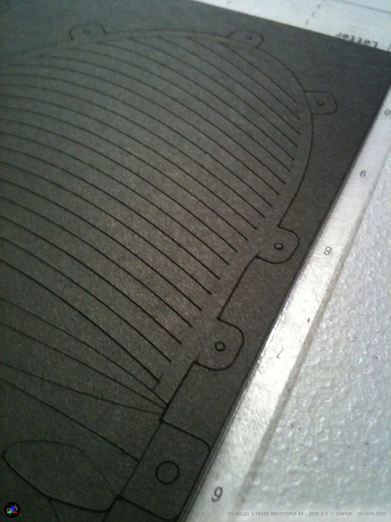 Cut lines raking across the sheet.